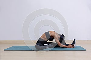 Female Trainer Warm Up with Leg Stretching on a Mat