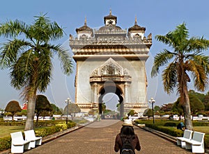 Female Traveler Heading to the Gate of Triumph or Patuxai in the Citycentre of Vientiane, Laos