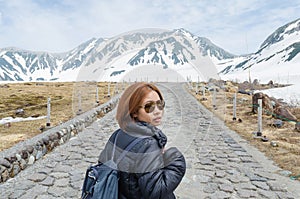 Female traveler and snow mountain at japan alps tateyama kurobe alpine