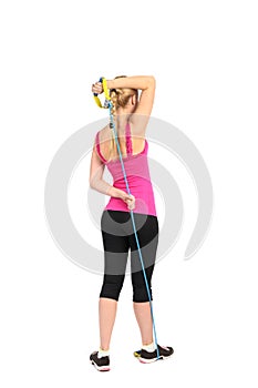 Female triceps extention exercise using rubber resistance band