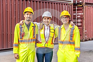 Female worker and two male workers wearing yellow safety vests.