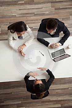 Female vacancy candidate answering questions at job interview, t