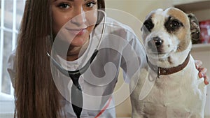 Female vet poses near the dog