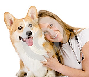 Female veterinarian and Pembroke Welsh Corgi dog.