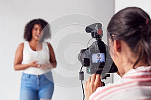 Female Videographer Recording Woman Recording Podcast In Studio