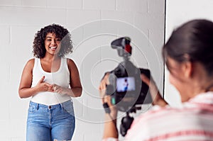 Female Videographer Recording Woman Recording Podcast In Studio