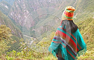 Female Visitor Enjoy a Stunning Aerial View of Aguas Calientes Town from Mt. Huayna Picchu, Machu Picchu, Cusco Region, Peru,