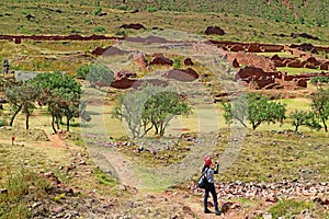 Female Visitor Photographing the Remains of Piquillacta, Pre-Inca Archaeological Site in the South Valley of Cusco Region, Peru