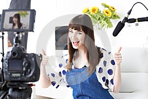 Female Vlogger Recording Broadcast At Home