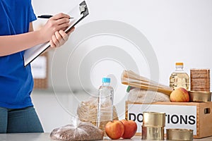 Female volunteer listing food products