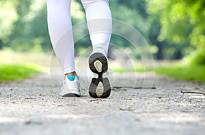 Female walking in running shoes outdoors