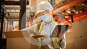 Female Warehouse Inventory Manager Wearing Face Mask for Safety, Using Digital Tablet Computer, Ch