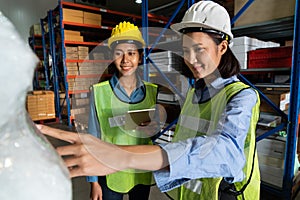 Female warehouse worker working at the storehouse