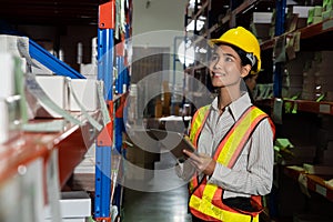 Female warehouse worker working at the storehouse