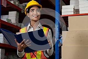 Female warehouse worker working at the storehouse