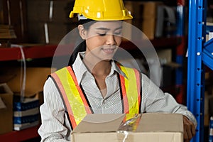 Female warehouse worker working at the storehouse