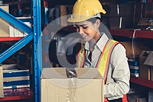 Female warehouse worker working at the storehouse