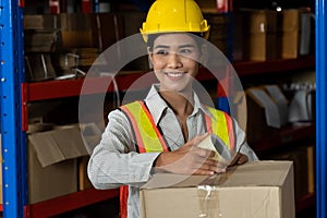Female warehouse worker working at the storehouse