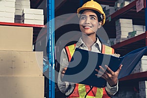 Female warehouse worker working at the storehouse