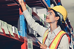 Female warehouse worker working at the storehouse