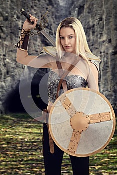 Female warrior getting ready to fight a dragon