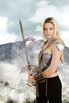 Female warrior with sword and mountain in background