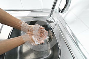 Female washing hands with liquid soap for preventing and stop corona virus spread