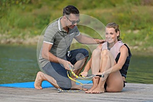 Female waterskiier learner with coach