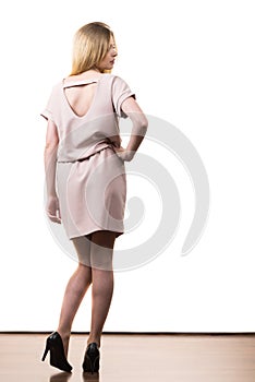 Female wearing casual pink tunic dress