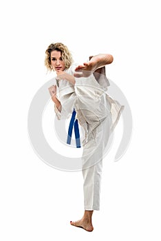 Female wearing martial arts uniform making karate move