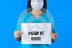 Female wearing mask protect virus and holding blank sheet with text