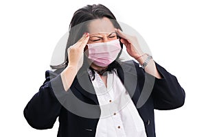 Female wearing medical mask having headache as covid19 symptom