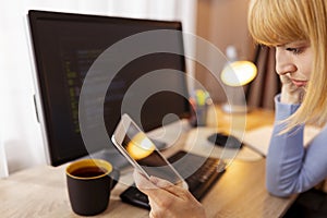 Female web developer working remotely from home