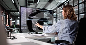 Female Web Developer Working On Software Code