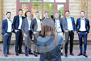 Female wedding photographer in action