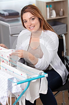 Female in wheelchair drying cloths