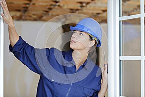 female window fitter checking installation