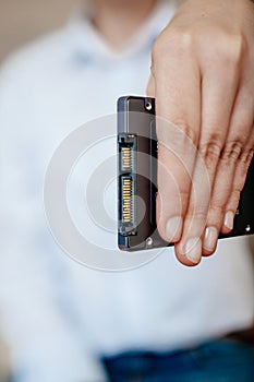 Female woman hand holding fast 4tb capacity ssd