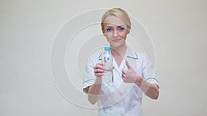Female woman nutritionist or dietician doctor healthy lifestyle concept - holding bottle of water