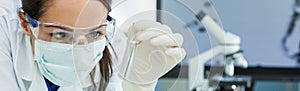 Female Woman Research Scientist With Test Tube In Laboratory Panorama photo