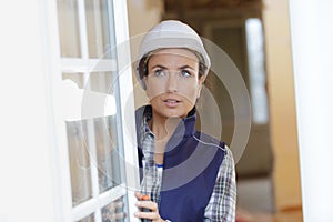 female worker adjusting window