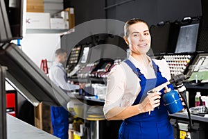 Female worker with airbrush