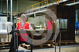 Female worker on beer factory. portrait woman in robe, standing on background line Food production, Inspection management control