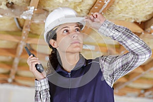 female worker checking celing