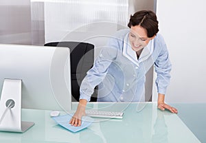 Female worker cleaning office