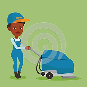 Female worker cleaning store floor with machine.