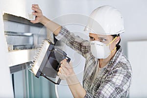 female worker dealing with window