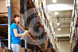 Female Worker In Distribution Warehouse