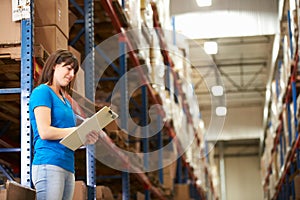 Female Worker In Distribution Warehouse