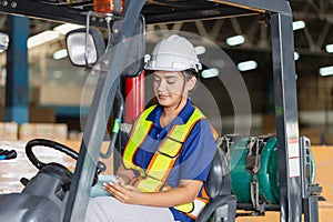 Female worker on forklift, Manual workers working in warehouse, Worker driver at warehouse forklift loader works